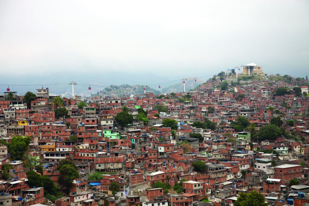 Complexo do Alemao is one of Rio's largest favelas. After pacification, there have been investments in new housing, and a new cable car transport system. UPP police stations are located at the cable car stops. Photograph by Tuca Viera for LSE Cities